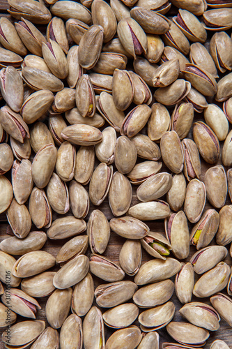 Background of pistachio nuts. Flat layout. Nuts close up