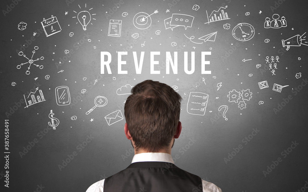 Rear view of a businessman with REVENUE inscription, modern business concept Rear view of a businessman with REVENUE inscription, modern business concept