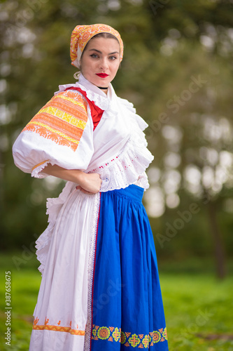 Beautiful woman wearing traditional Eastern Europe folk costumes.  Slovak folklore. © muro