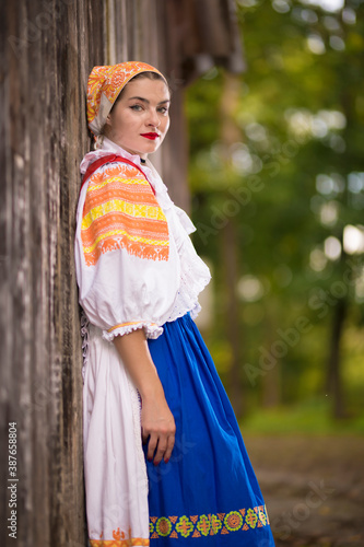Beautiful woman wearing traditional Eastern Europe folk costumes. Slovak folklore.