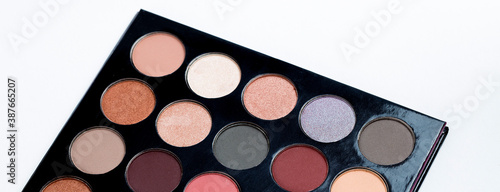 Colorful eye shadows palette. Colorful make-up palette background.