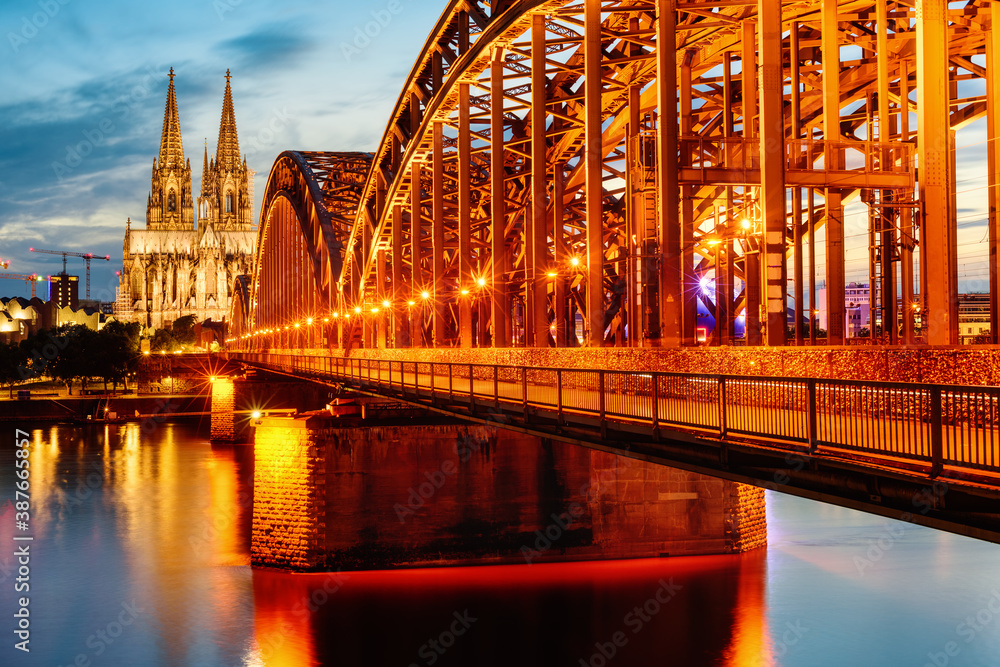Hohenzollern Bridge and Cathedral in Cologne city, Germany