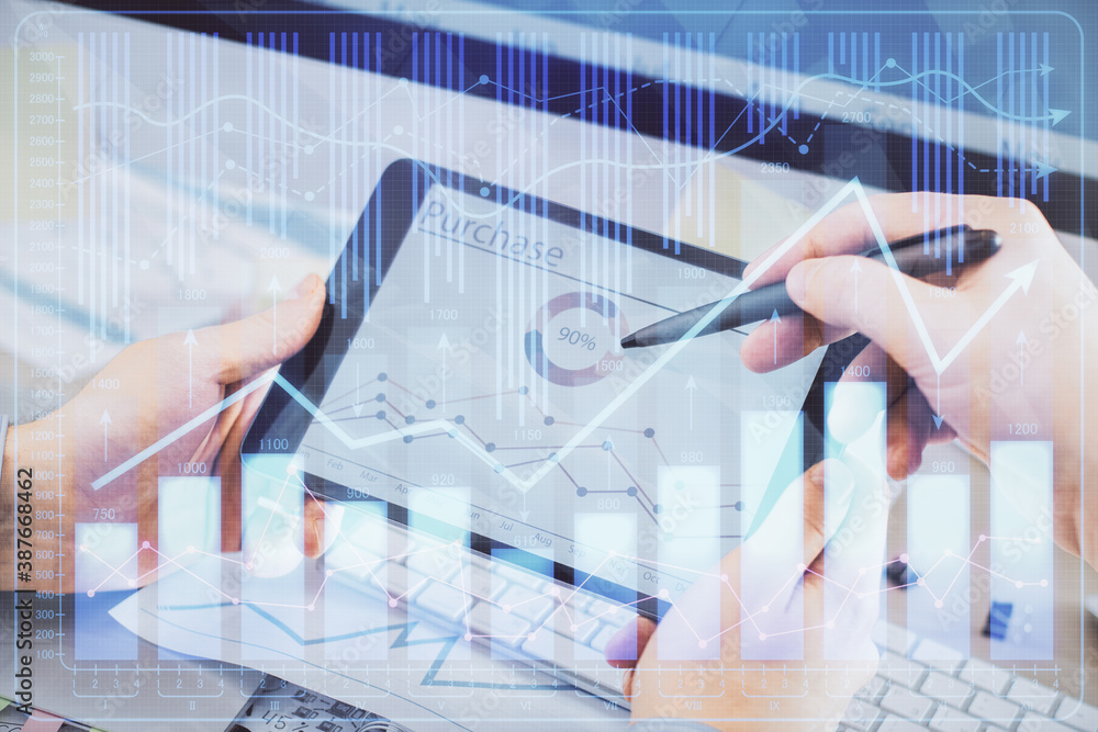 Double exposure of man's hands holding and using a phone and financial chart drawing. Market analysis concept. Double exposure of man's hands holding and using a phone and financial chart drawing. Market analysis concept.