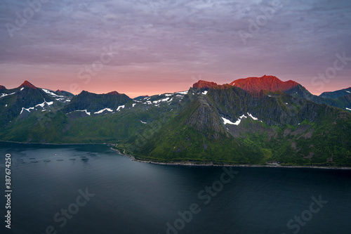 Sunset over Senja island in Northern Norway , mount Hesten in the middle of frame. (high ISO image) photo