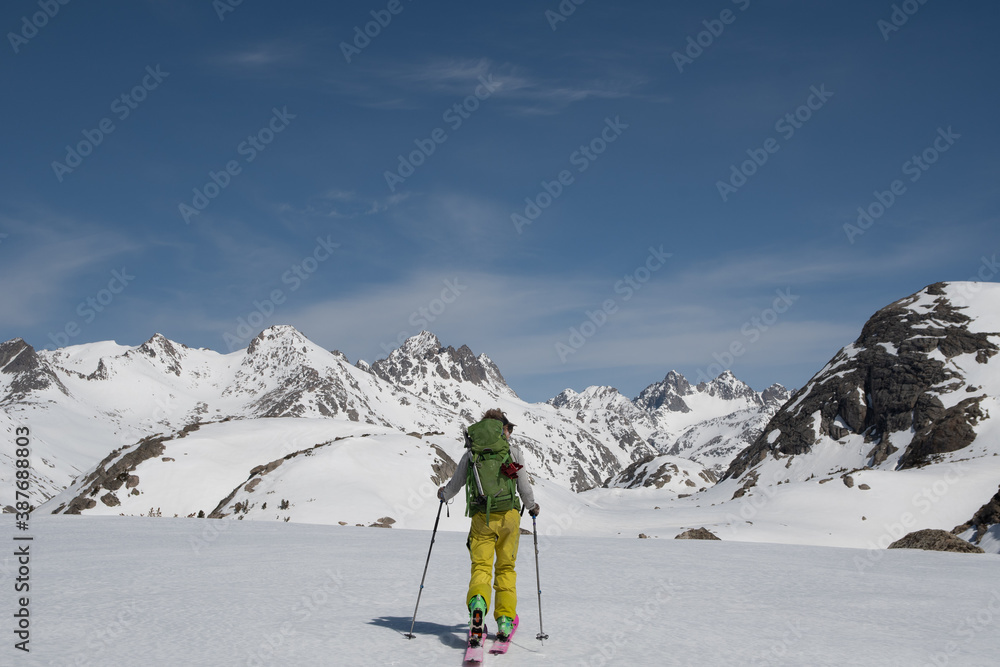 Skier approaching mountains winter