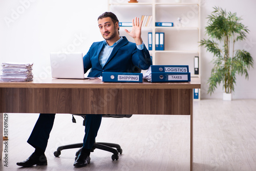 Young male businessman employee working in the office