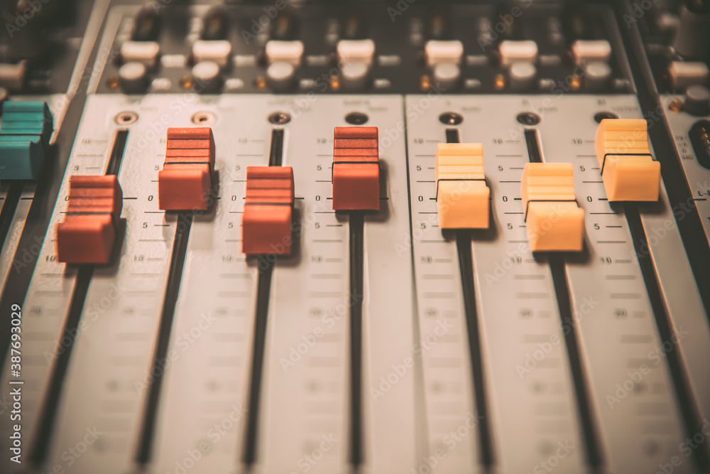 Close-up audio mixer in studio for recording editor equipment and instrument sound broadcasting concept. Close-up audio mixer in studio for recording editor equipment and instrument sound broadcasting concept.