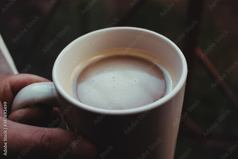 Cup of coffee in front of the window in the morning Cup of coffee in front of the window in the morning