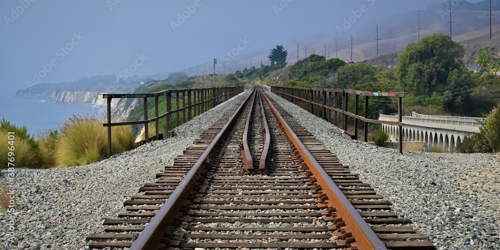 Fototapeta premium railroad tracks and bridge near the ocean