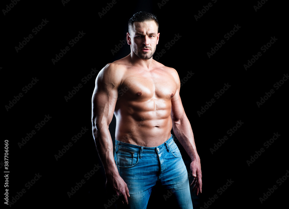 Strong man showing his perfect naked body. Bare torso.