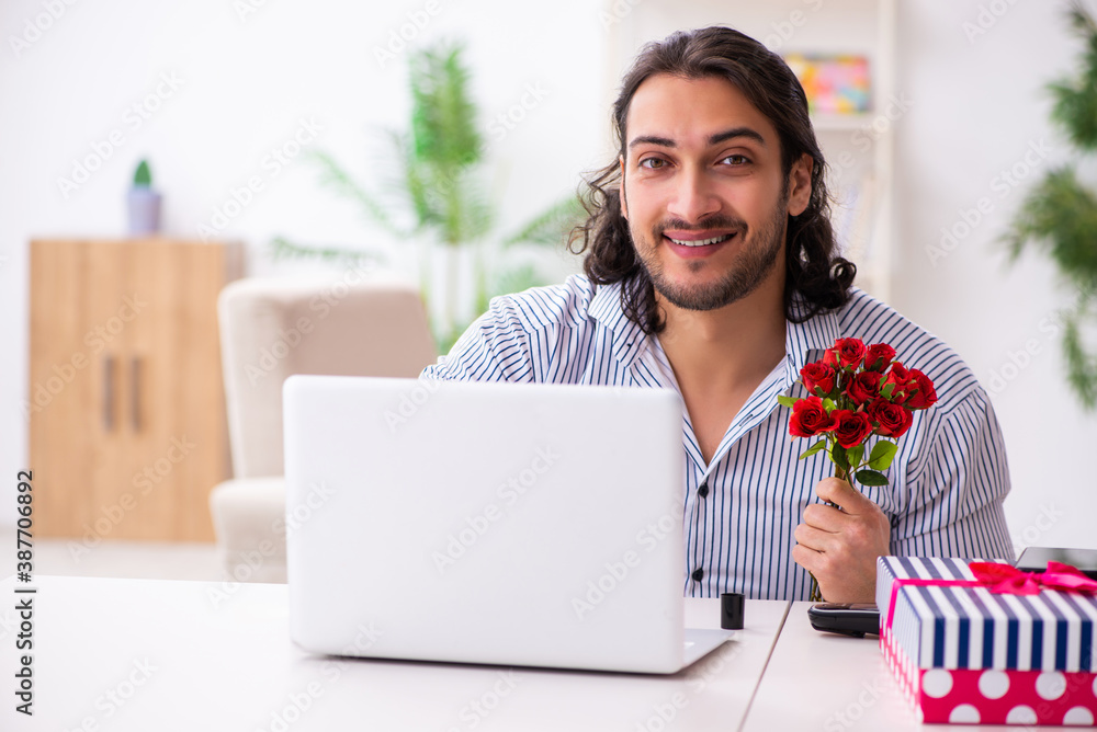 Young man in christmas concept at home Young man in christmas concept at home