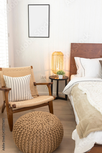 Master bedroom in rustic style with minimalist white double bed and hanging lamp.