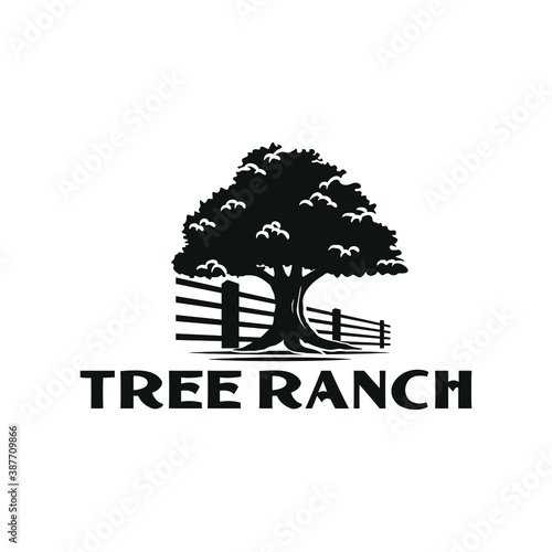 vintage big tree with wooden fence ranch logo
