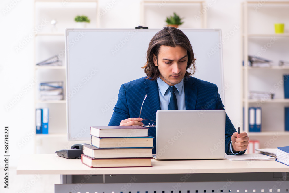 Young businessman student studying at workplace Young businessman student studying at workplace