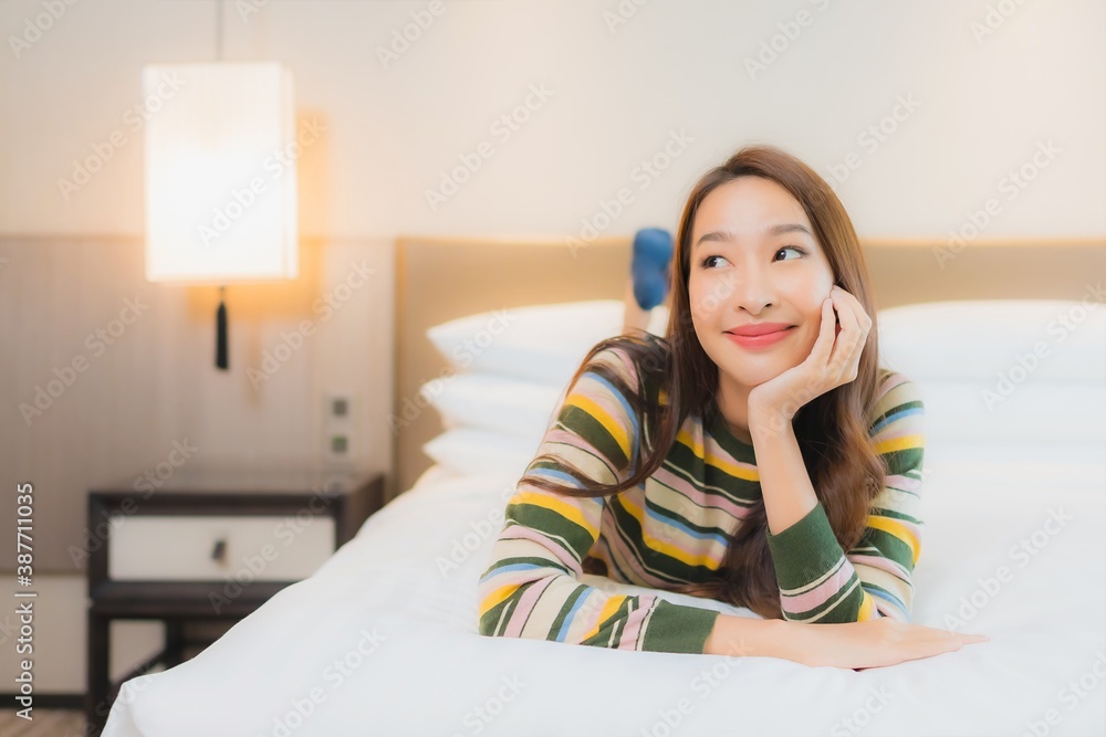 Portrait beautiful young asian woman smile happy relax on bed Portrait beautiful young asian woman smile happy relax on bed