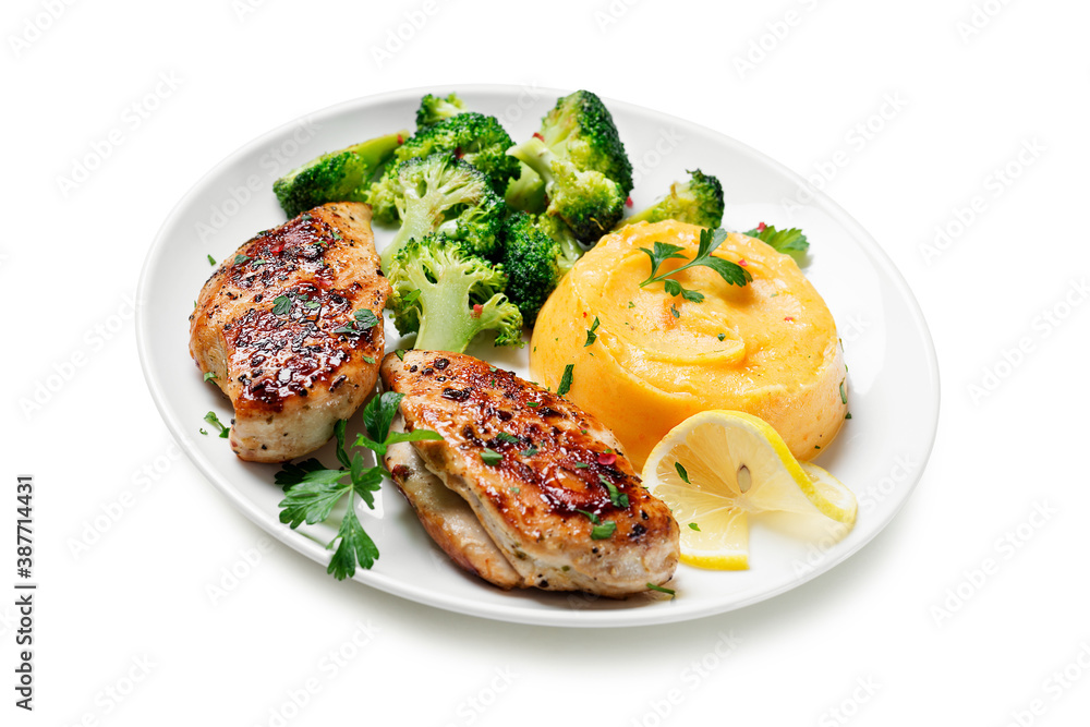 Grilled Chicken breast or fillet served with mashed sweet potato and stir fry broccoli. Healthy diet menu for lunch. isolated on white background