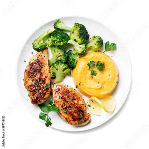 Grilled Chicken breast or fillet served with mashed sweet potato and stir fry broccoli. Healthy diet menu for lunch. top view .isolated on white background