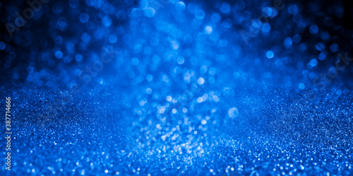 Majestic blue-purple sparkle snow. Christmas background for design, cards, posters. Cosmic star explosion.