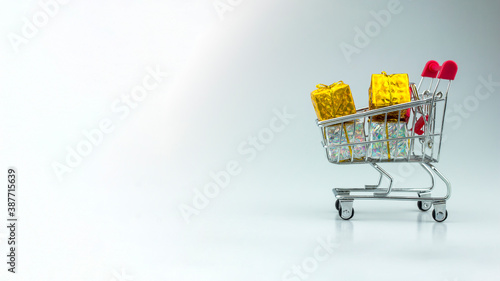 shopping cart full of gifts box.