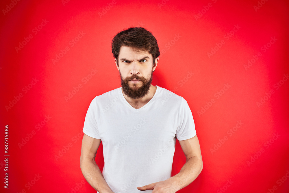 man in t-shirt gesturing with his hands dissatisfaction studio red uniform man in t-shirt gesturing with his hands dissatisfaction studio red uniform