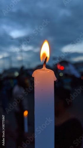 burning candle in the dark