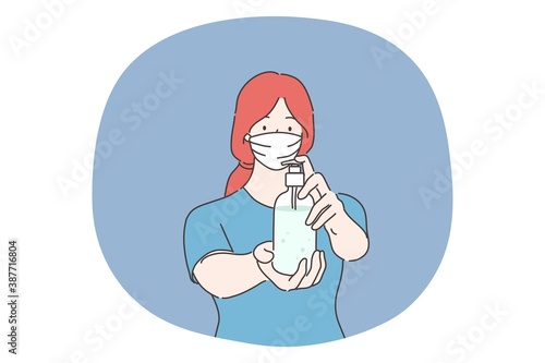 Healthcare, quarantine, protection, coronavirus infection concept. Young woman with medical face mask pouring hygienic antiseptic on hands. Sanitary measures from covid19 disease or 2019ncov biohazard