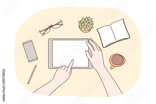 Technology, mobile, social media, business concept. Human character designer hands using blank tablet in office workplace for jub web network communication. Digital technological gadgets in daily life