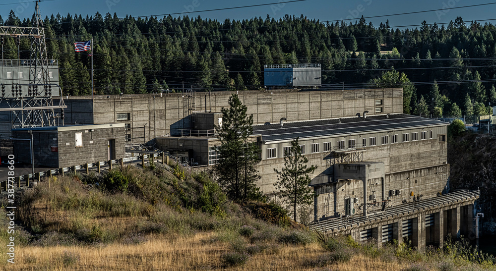 Fototapeta premium Albeni Falls Dam and Powerhouse on the Pend Oreille River between Oldtown and Priest Idaho completed in 1955 at a cost of 34 million dollars. 