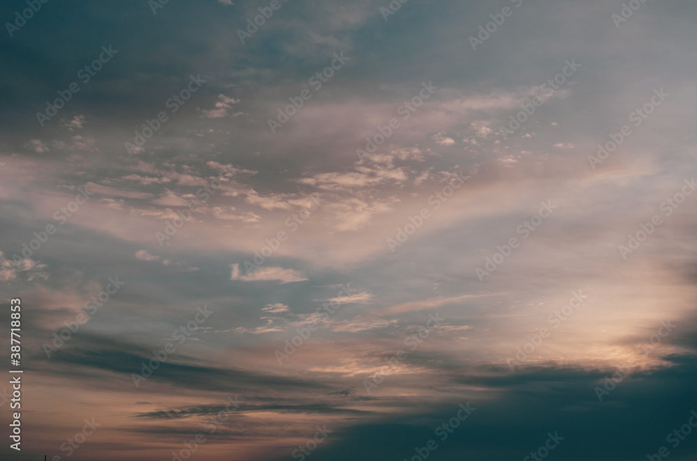 Fototapeta premium Sunset in the clouds in the form of tracks Sunset light Clouds in the form of long orange stripes in the sky