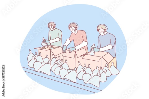 Coronavirus, medicine, selection, support, volunteering concept. Team of young men volunteers in medical face masks packing delivery supplies together. Health medical service and humanitarian help.