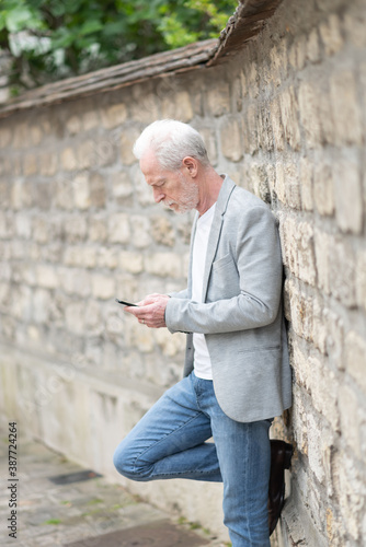 Mature man using his mobile phone