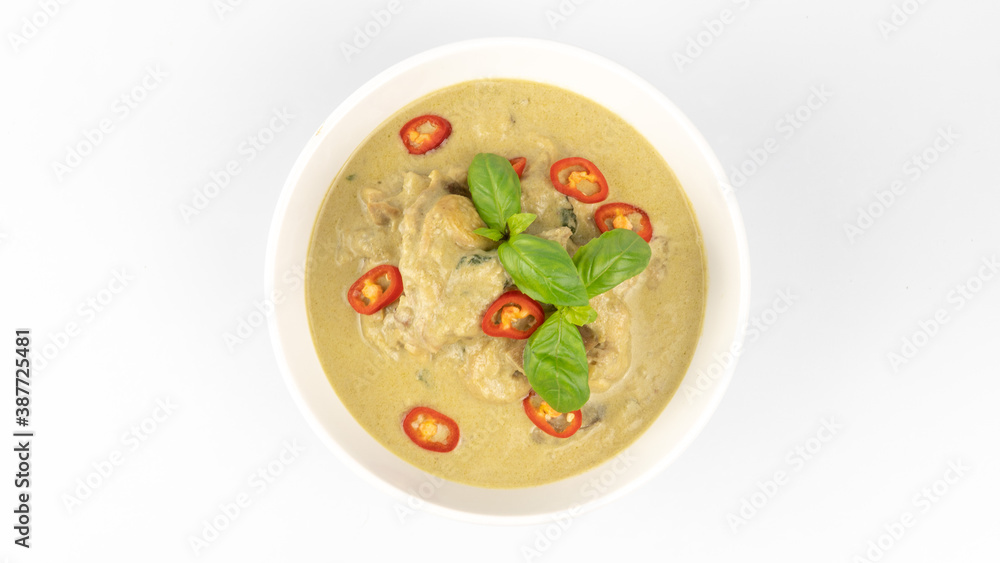 Traditional Thai cuisine, green curry chicken in white bowl over white background Traditional Thai cuisine, green curry chicken in white bowl over white background