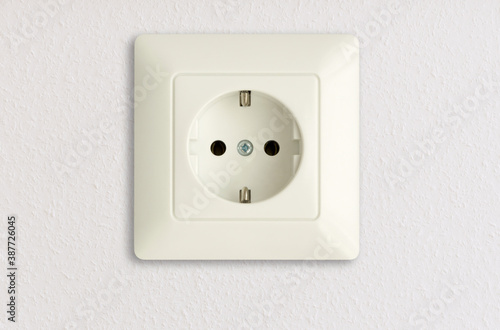 electric power socket on white wall, european standard, electrical power outlet