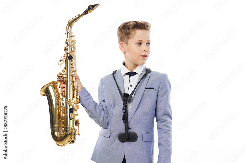 Fototapeta premium Boy musician playing saxophone performing jazz 