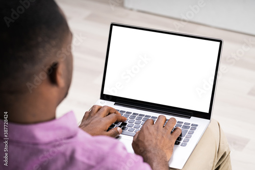 African American Man Using Laptop Computer
