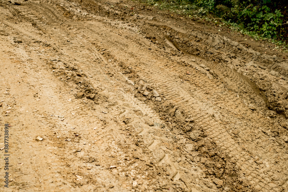 traces of cars in the mud traces of cars in the mud