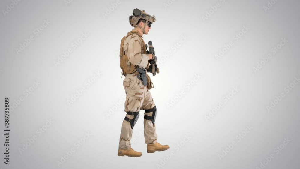 Armed Marine Soldier with rifle walking on gradient background. Armed Marine Soldier with rifle walking on gradient background.