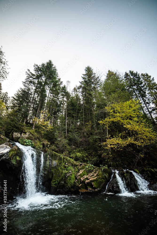 Rapid mountain river with a waterfall in the national park Rapid mountain river with a waterfall in the national park
