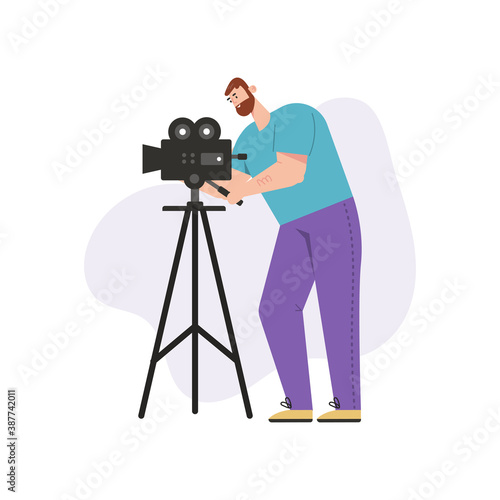 Videographer shoots film on professional camera isolated