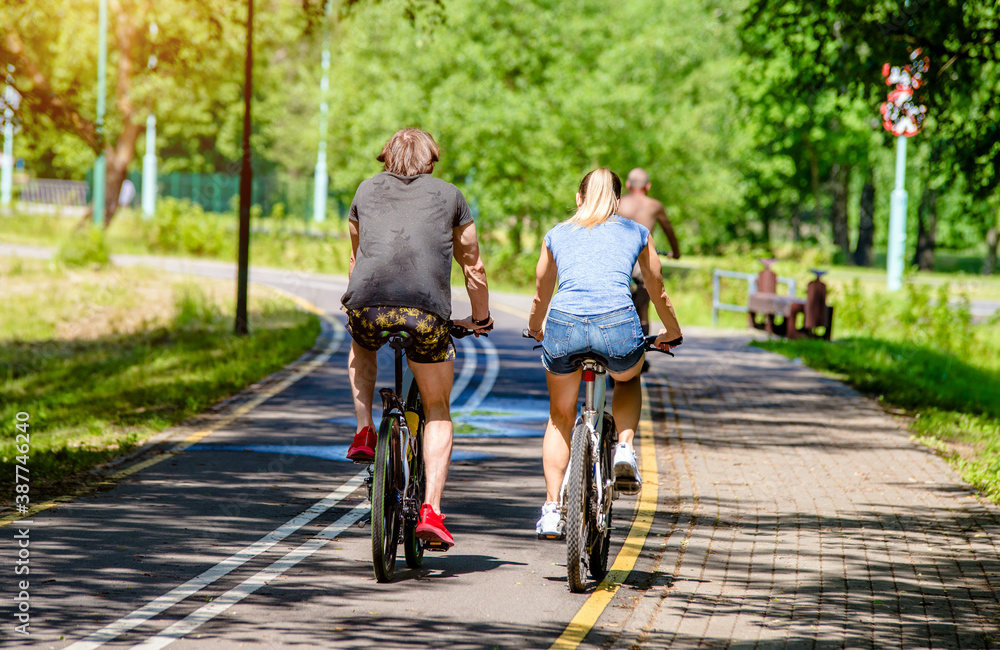 Cyclists ride on the bike path in the city Park
Cyclists ride on the bike path in the city Park