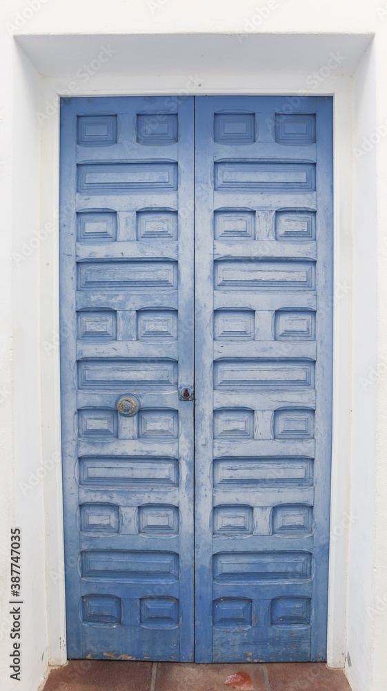 Fototapeta premium colored wooden doors with metal knobs