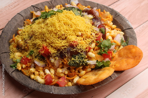 Bhelpuri Chaat/chat is a road side tasty food from India, served in a plate. photo