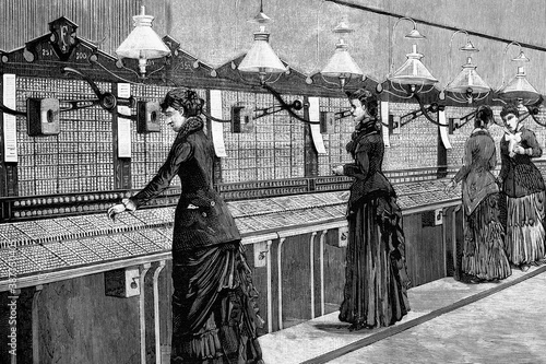 Milan, Italy. Central telephone office called switching room manned by female employees. Antique illustration. 1882.