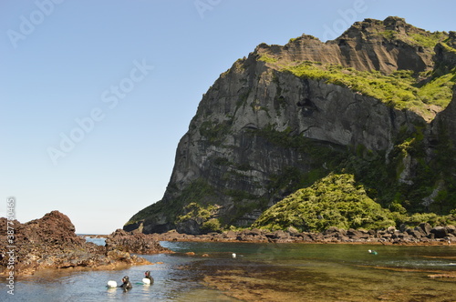 Hiking in the mountains, volcanoes and lava tunnels of Jeju Island, South Korea photo