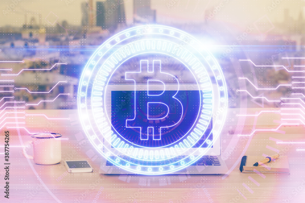 Double exposure of blockchain theme hologram and table with computer background. Concept of bitcoin crypto currency. Double exposure of blockchain theme hologram and table with computer background. Concept of bitcoin crypto currency.