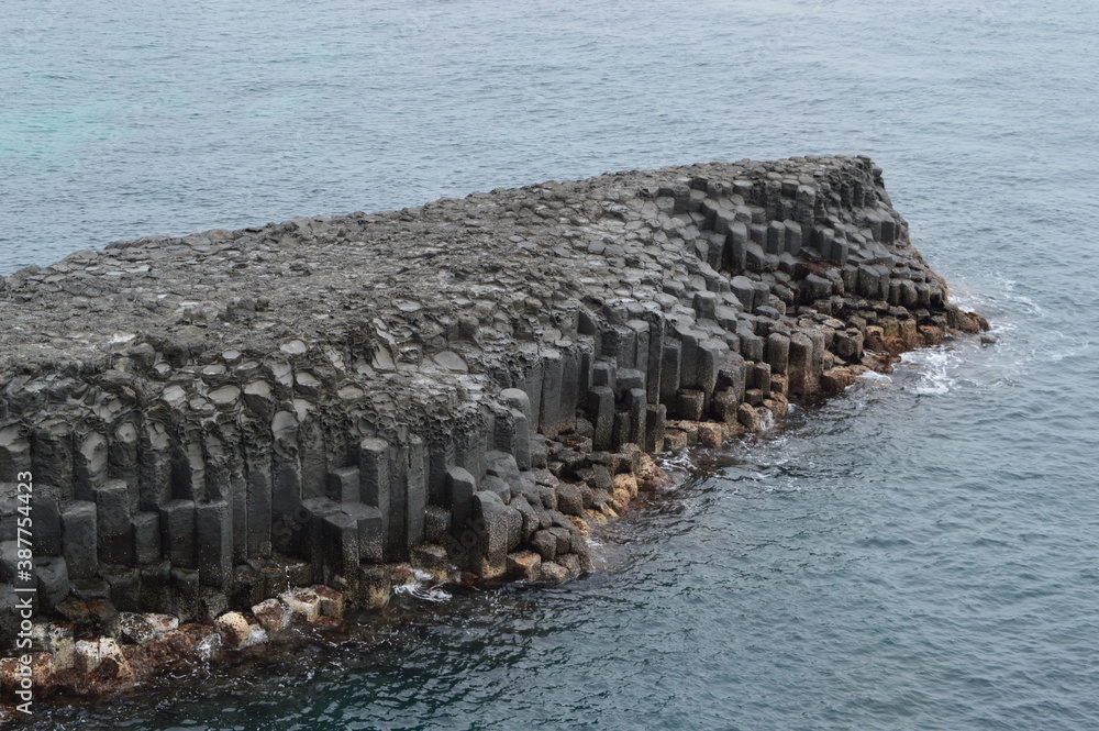 Fototapeta premium Exploring the waterfalls and coastal landscapes of the Jeju Island in South Korea