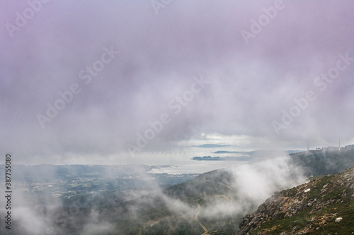 Aerial view of Rianxo on the Ria de Arousa estuary from the Muralla mountain on a foggy Summer afternoon. photo