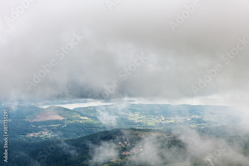 Aerial view of Rianxo on the Ria de Arousa estuary from the Muralla mountain on a foggy Summer afternoon.