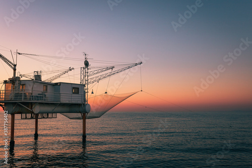 Fotografie Marina di Ravenna, Ravenna / Italy - August 2020: Molo Zaccagnini during the sun