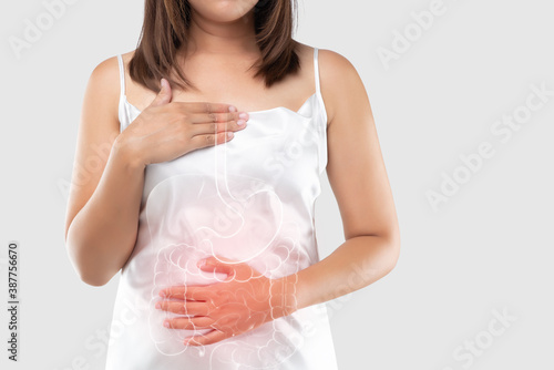 Gastroesophageal reflux disease or Acid reflux. illustration of the intestine and internal organs in the women's body and Space right side. The concept of medical treatment and healthcare